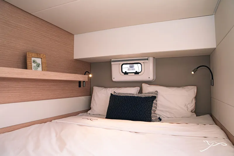 Slide: The Image of Cozy cabin interior of 2025 Nautitech 40 Open catamaran with modern bedding and reading lights. - 43