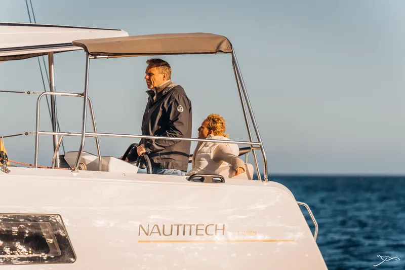 Slide: The Image of Couple enjoying a cruise on a 2025 Nautitech 44 Open yacht. - 17