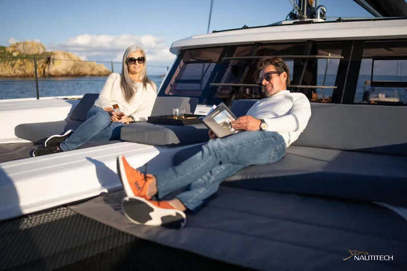 Slide: The Image of Couple relaxing on 2025 Nautitech 48 Open yacht deck, enjoying leisure time. - 20