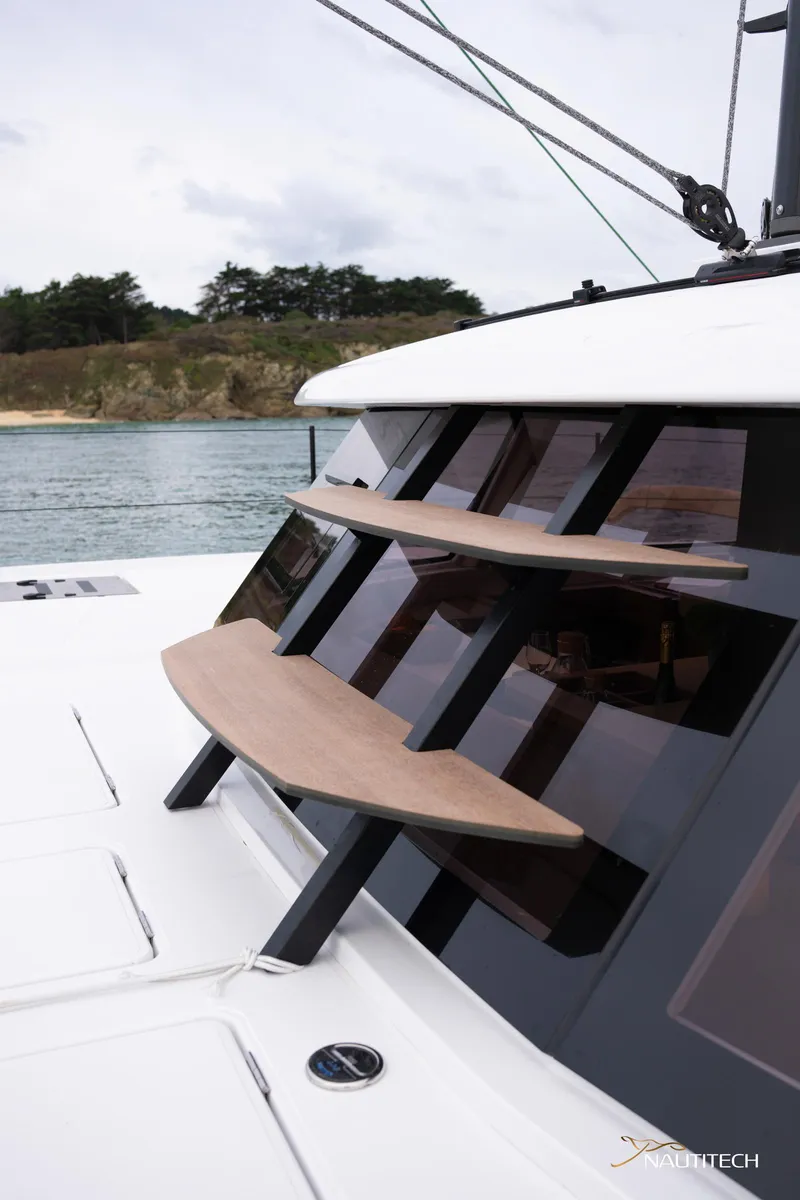 Slide: The Image of 2025 Nautitech 48 Open yacht with sleek design and modern windows. - 22