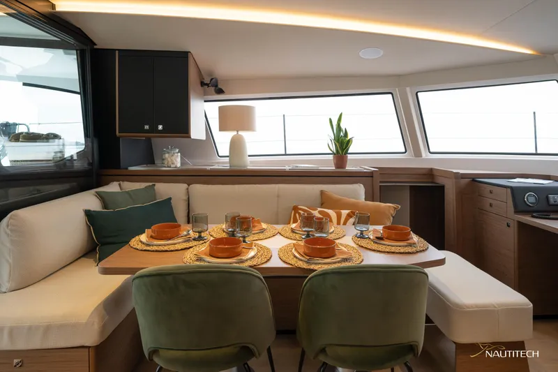 Slide: The Image of Luxurious interior of 2025 Nautitech 48 Open yacht with elegant dining setup. - 38