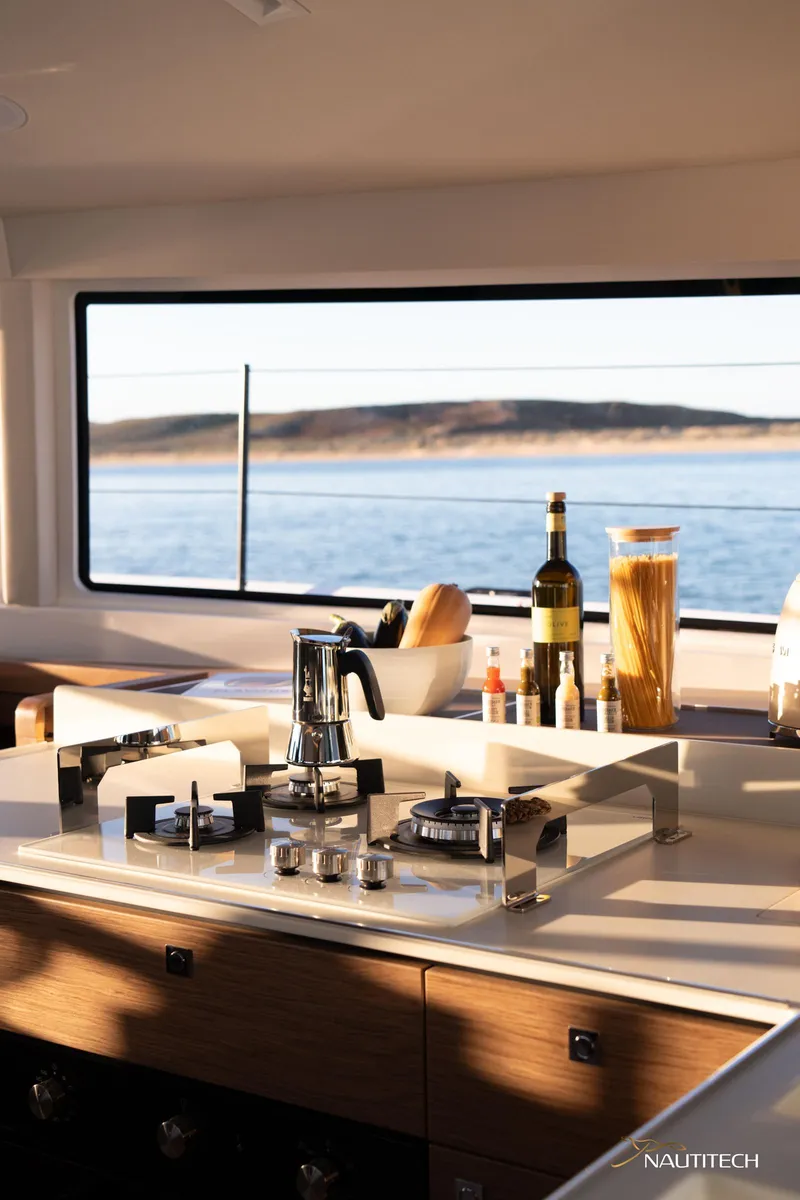 Slide: The Image of Modern kitchen interior of 2025 Nautitech 48 Open yacht with ocean view. - 48