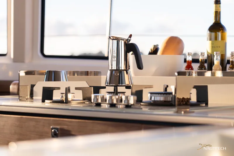 Slide: The Image of Modern kitchen on Nautitech 48 Open yacht, featuring sleek appliances and elegant design, 2025 model. - 49
