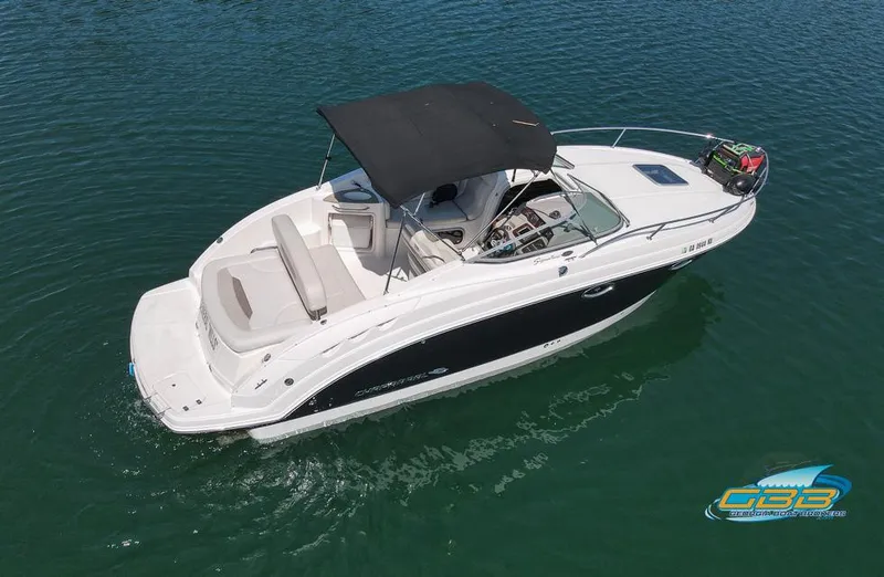 Slide: The Image of 2008 Chaparral Signature 250 boat with black canopy on calm water. - 14