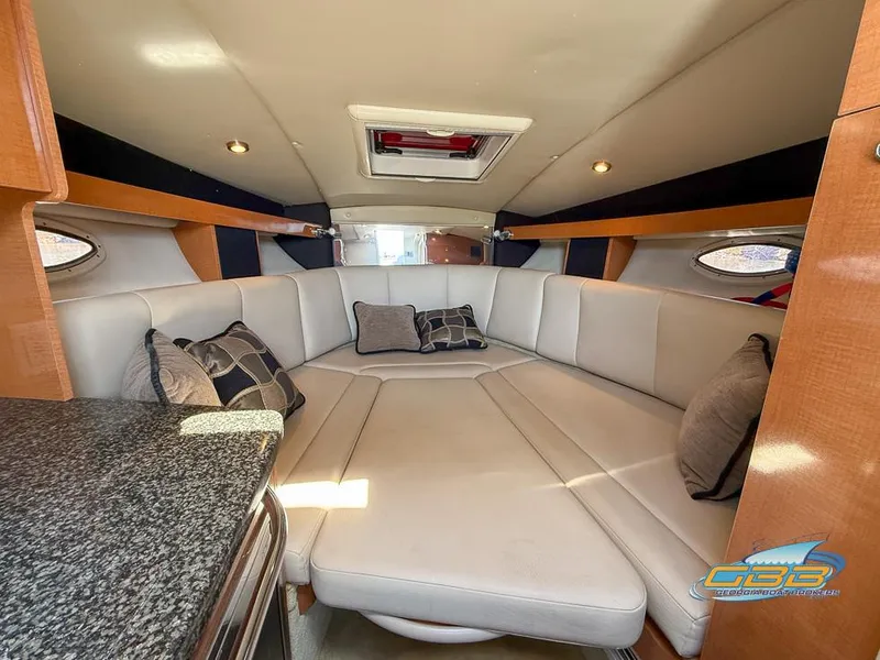 Slide: The Image of 2008 Chaparral Signature 250 cabin interior with plush seating and modern design. - 23