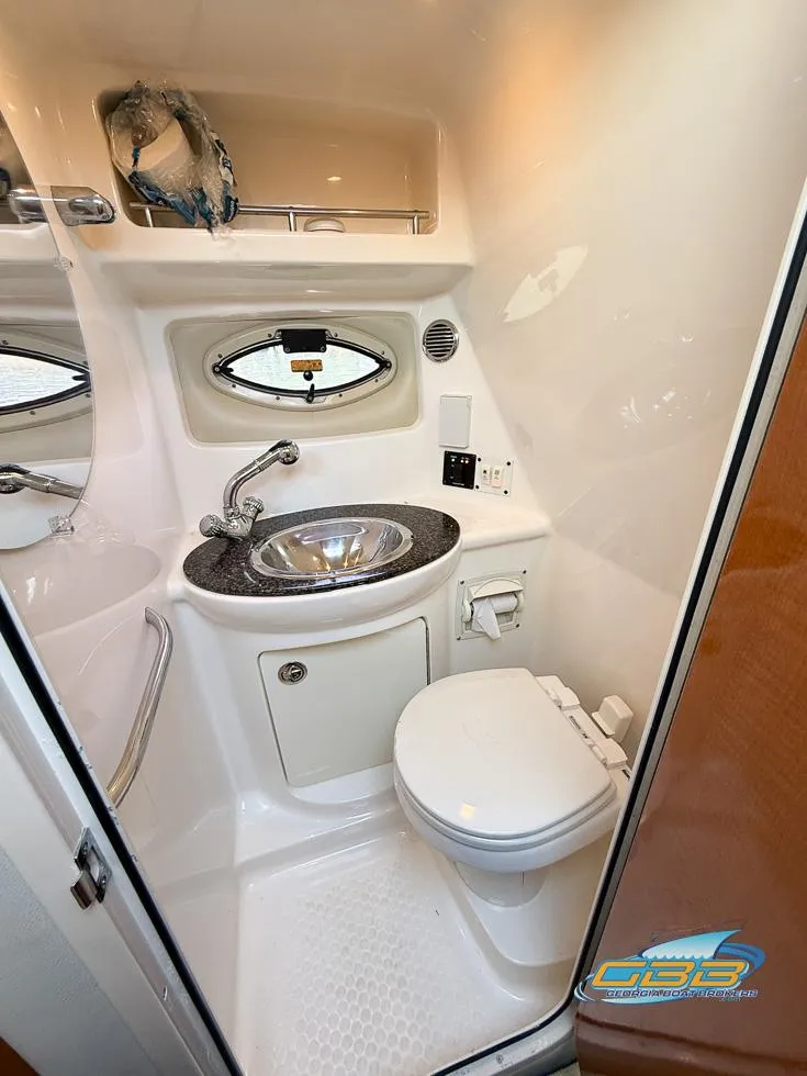 Slide: The Image of 2008 Chaparral Signature 250 bathroom with sink, toilet, and mirror. - 28