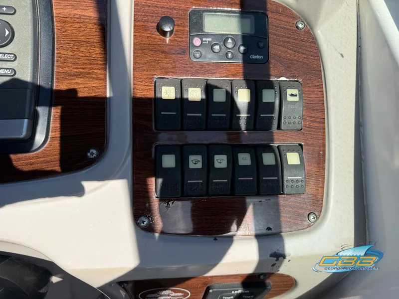 Slide: The Image of 2008 Chaparral Signature 250 dashboard with control panel and switches. - 30