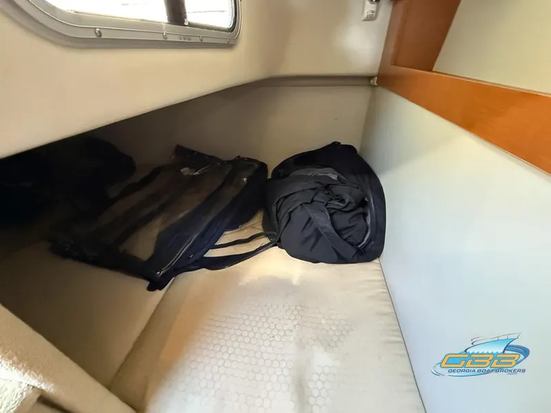 Slide: The Image of Interior cabin of 2008 Chaparral Signature 250 with bags on bed. - 34