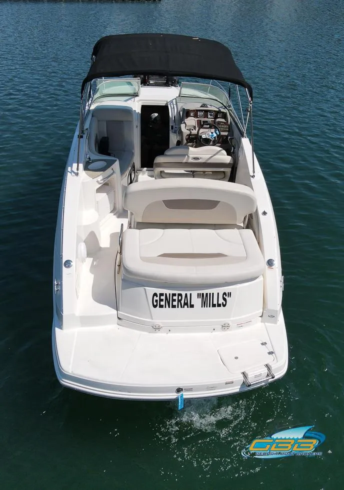 Slide: The Image of 2008 Chaparral Signature 250 boat with black canopy on water. - 9