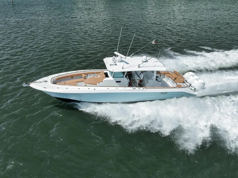 Slide: The Image of 2022 HCB Lujo boat cruising on open water, showcasing sleek design and powerful performance. - 10