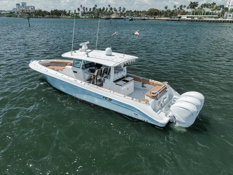 Slide: The Image of 2022 HCB Lujo boat cruising on a sunny day in open water. - 15