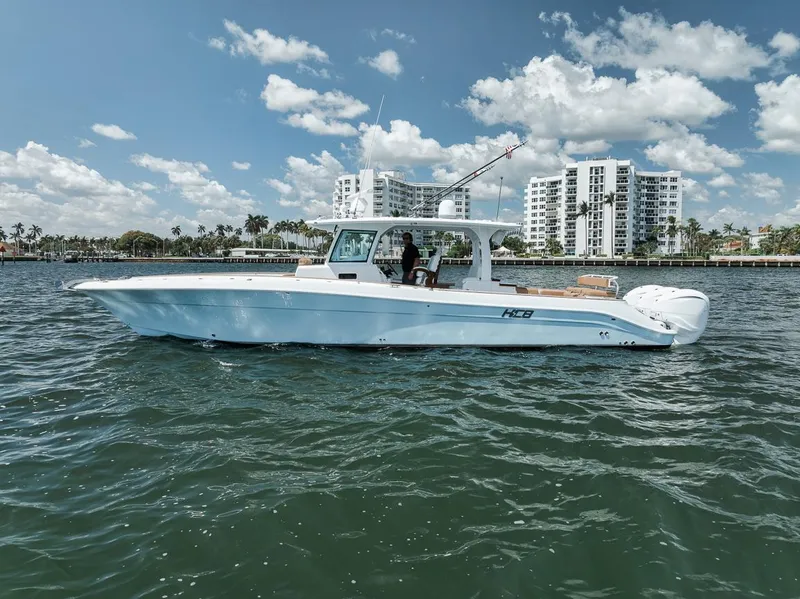 Slide: The Image of 2022 HCB Lujo boat cruising on water with cityscape background. - 3