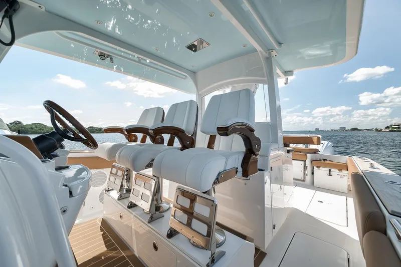 Slide: The Image of Luxury interior of 2022 HCB Lujo boat with elegant seating and ocean view. - 36