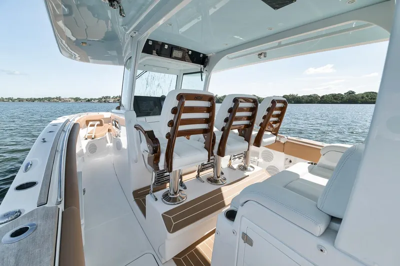 Slide: The Image of Luxury HCB Lujo 2022 boat interior with sleek seating and modern design on open water. - 38