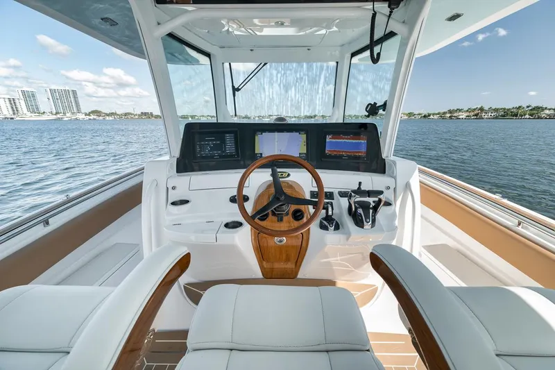 Slide: The Image of Cockpit of 2022 HCB Lujo boat with modern controls and scenic water view. - 40