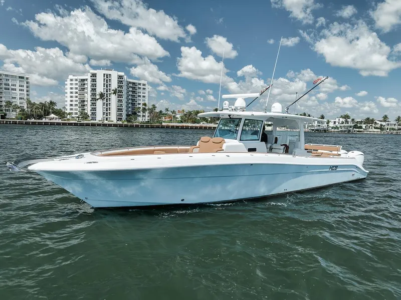 The Image of 2022 HCB Lujo boat cruising on water with cityscape background. - 1