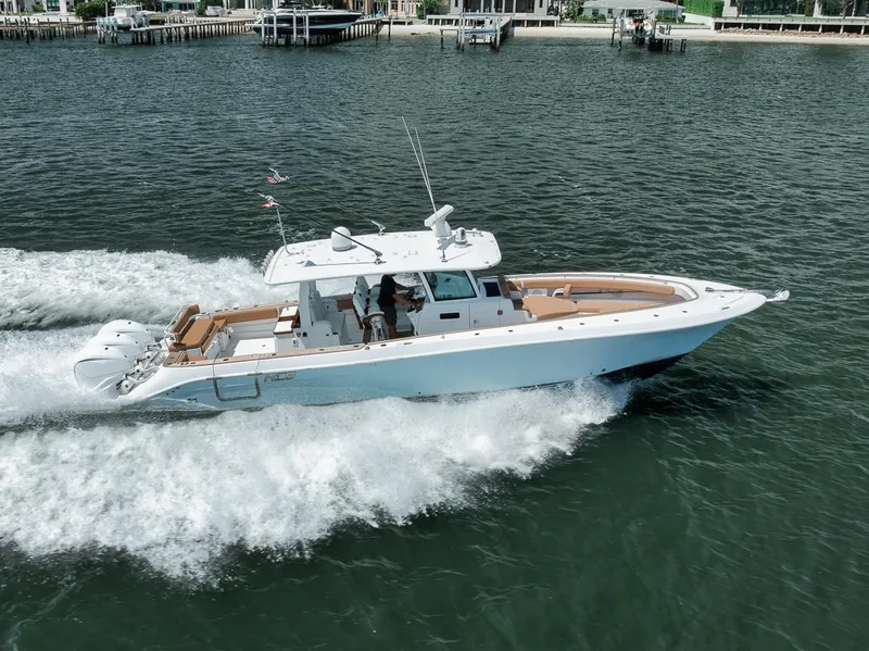 Slide: The Image of 2022 HCB Lujo boat cruising on water, showcasing sleek design and powerful engines. - 11