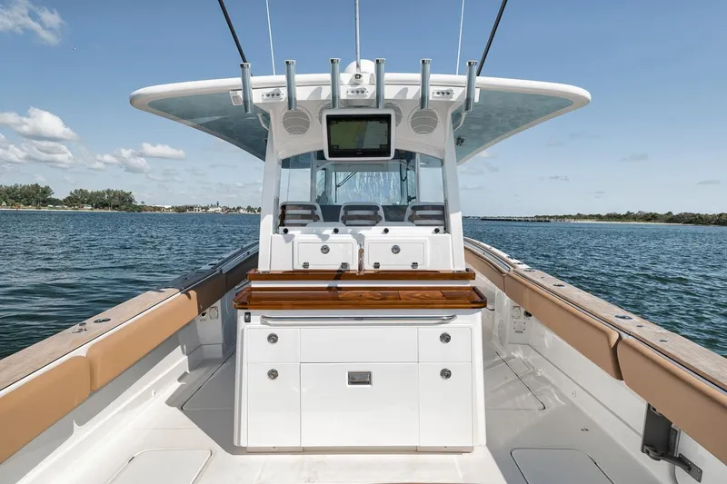 Slide: The Image of 2022 HCB Lujo boat interior with helm, seating, and ocean view. - 28