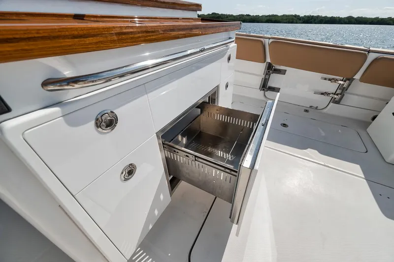 Slide: The Image of Luxury HCB Lujo 2022 boat with open stainless steel drawer on deck. - 31