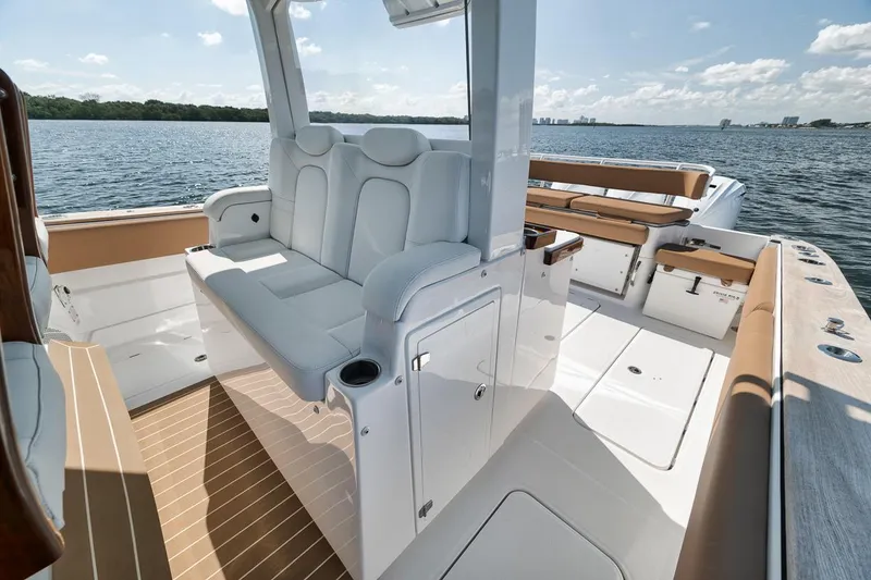 Slide: The Image of 2022 HCB Lujo boat interior with luxurious seating and sleek design on open water. - 33