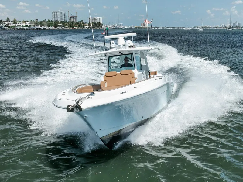 Slide: The Image of 2022 HCB Lujo boat cruising swiftly on open water, creating a dynamic wake. - 6