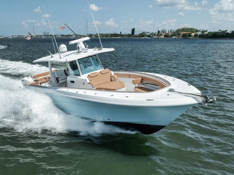 Slide: The Image of 2022 HCB Lujo boat cruising on a sunny day, showcasing sleek design and luxury features. - 8