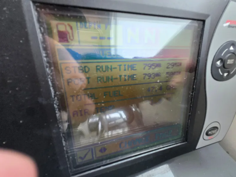 Slide: The Image of Display screen showing engine run-time and fuel data on a 2006 Pursuit 3370 Offshore boat. - 22