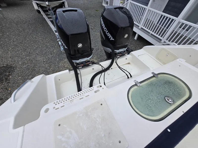 Slide: The Image of 2006 Pursuit 3370 Offshore boat with dual Mercury outboard engines, rear deck view. - 7