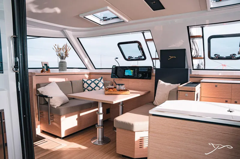 Slide: The Image of Luxurious interior of 2025 Nautitech 40 Open catamaran with modern seating and navigation equipment. - 28