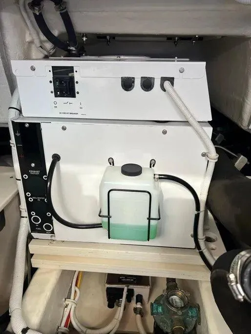 Slide: The Image of Engine compartment of a 2016 Tiara Yachts Q44, showcasing electrical and fluid systems. - 35