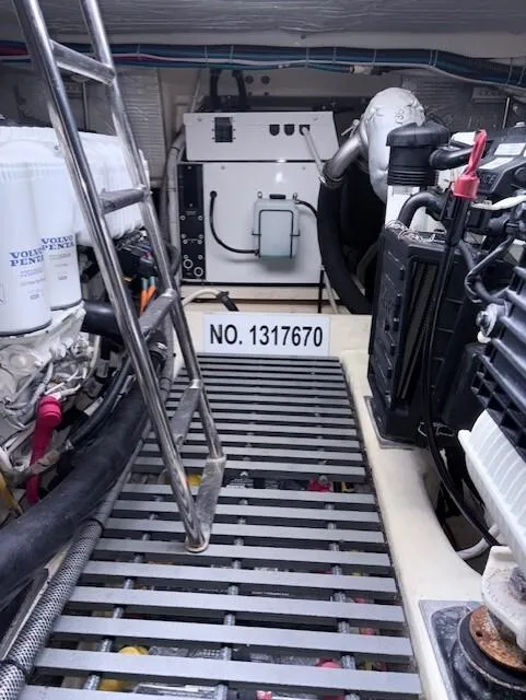 Slide: The Image of Engine room of 2016 Tiara Yachts Q44 with visible machinery and equipment. - 37