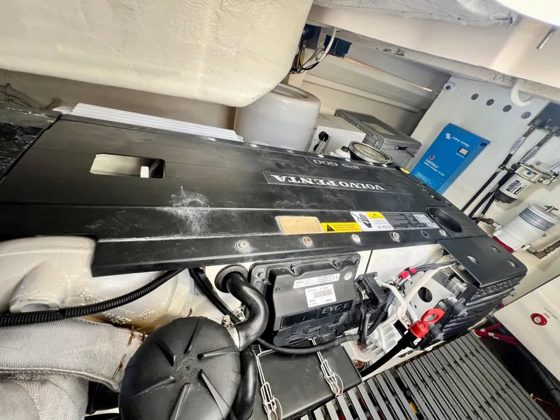Slide: The Image of Engine compartment of a 2016 Tiara Yachts Q44, featuring a Volvo Penta engine. - 46