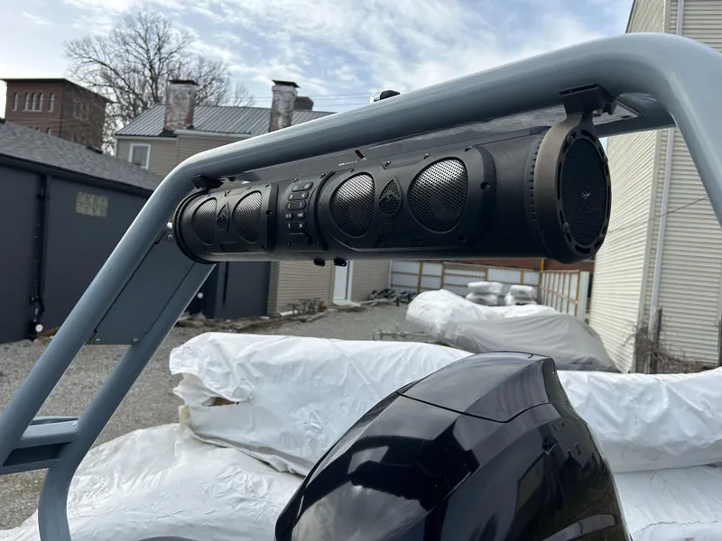 Slide: The Image of Highfield Sport 460 (2021) boat with mounted speaker system, outdoor setting. - 3