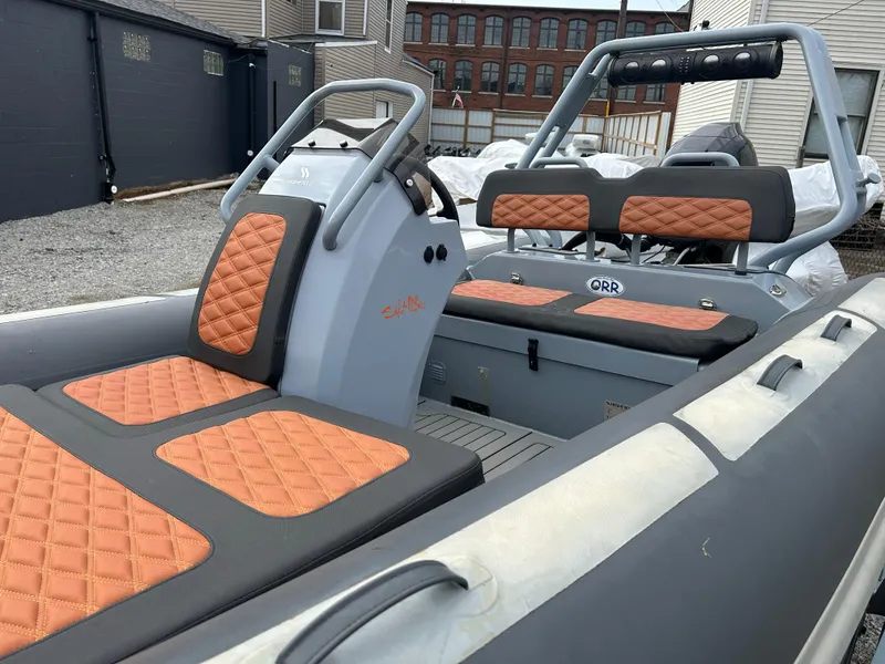 Slide: The Image of 2021 Highfield Sport 460 boat with orange quilted seats and sleek design. - 5