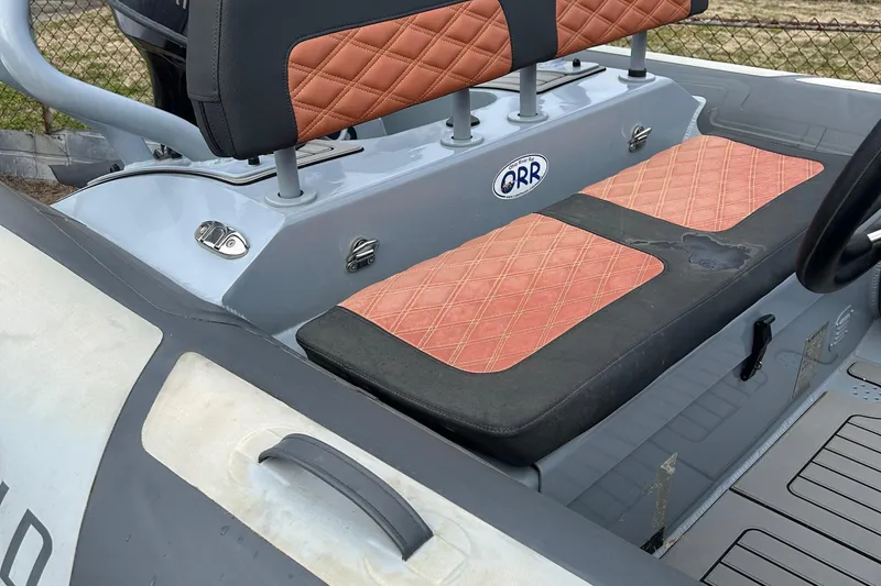 Slide: The Image of 2021 Highfield Sport 460 boat interior with quilted seating and ORR logo. - 6
