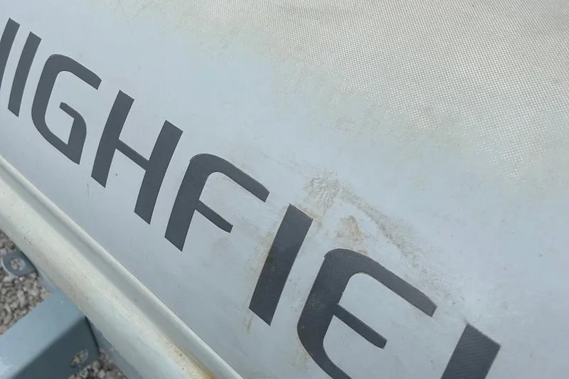 Slide: The Image of Highfield Sport 460 boat, close-up of logo, 2021 model. - 7