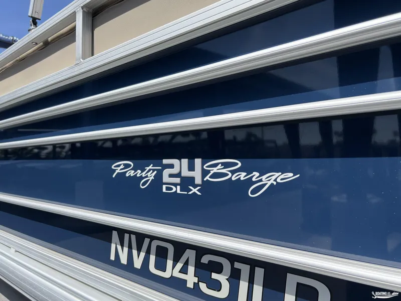 Slide: The Image of 2020 Sun Tracker Party Barge 24 DLX, blue exterior with registration number NV0431LD. - 3