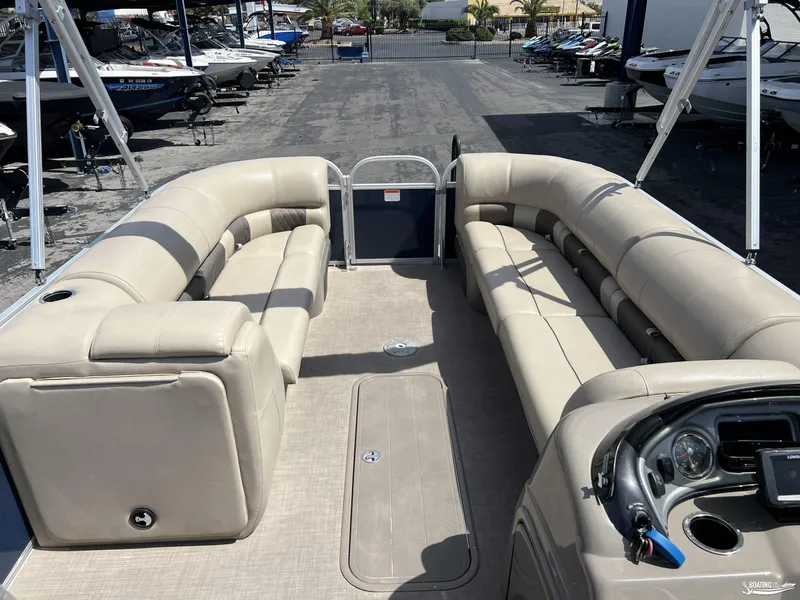 Slide: The Image of 2020 Sun Tracker Party Barge 24 DLX with spacious seating and modern dashboard. - 8
