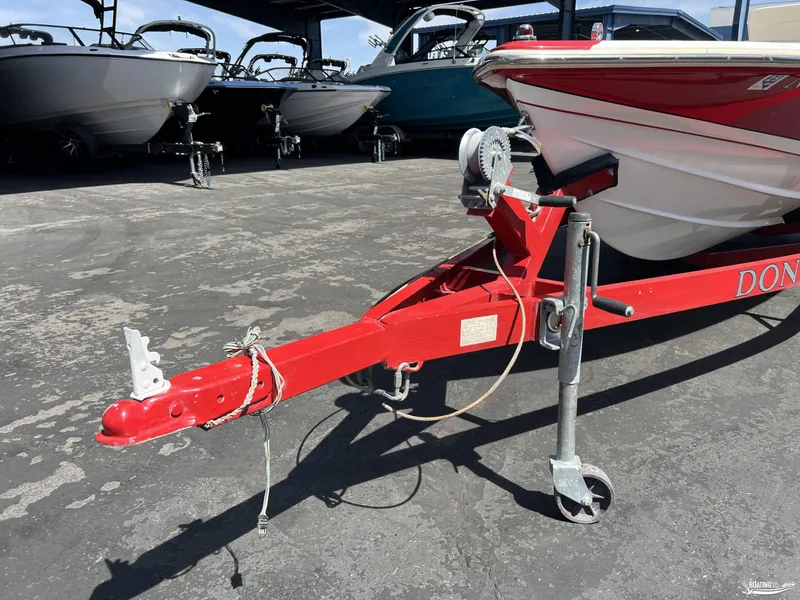 Slide: The Image of Red 1996 Donzi Sweet 16 boat on trailer, parked in a marina. - 17