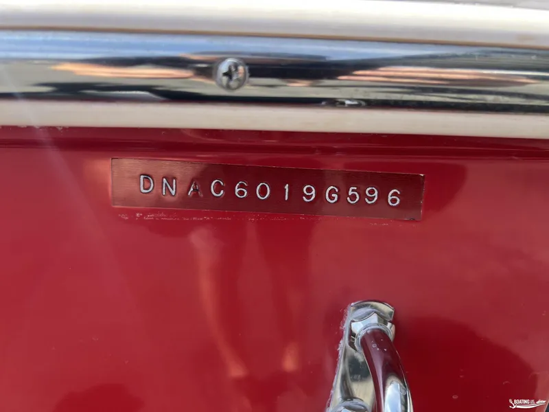 Slide: The Image of 1996 Donzi Sweet 16 boat hull identification number on red surface. - 20