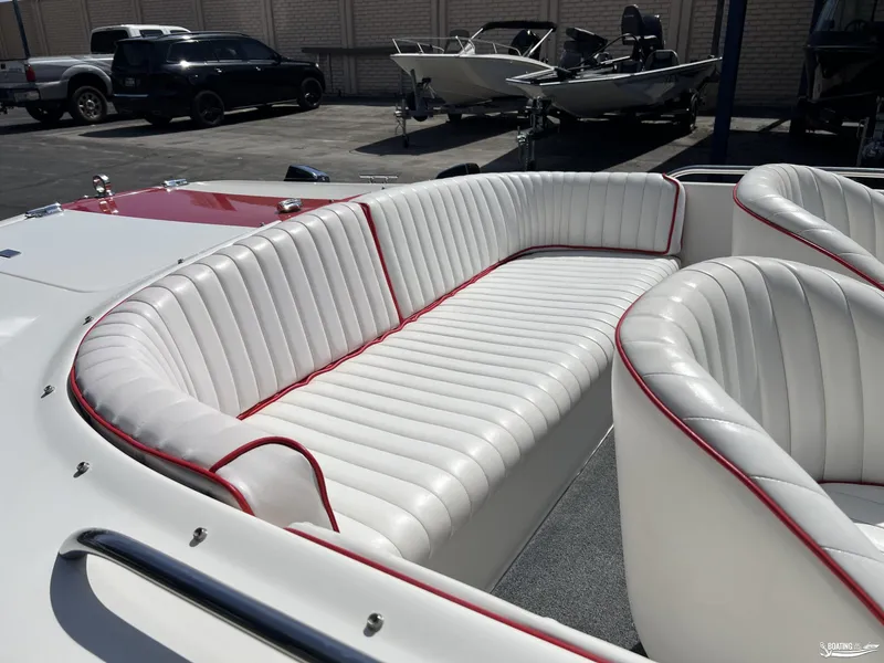 Slide: The Image of 1996 Donzi Sweet 16 boat interior with white and red-trimmed seating. - 7