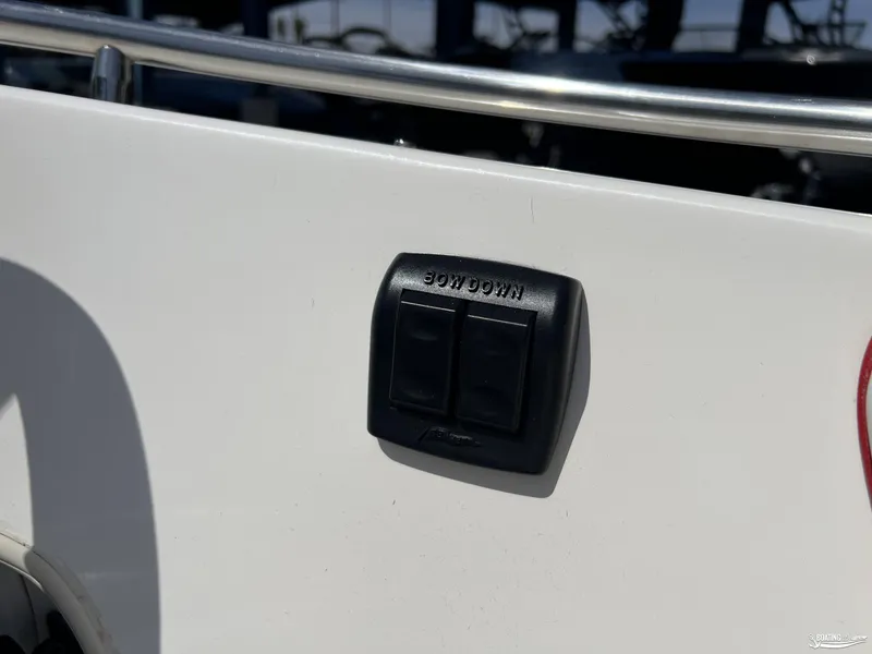 Slide: The Image of 1996 Donzi Sweet 16 boat control panel with "Bow Down" switch. - 8