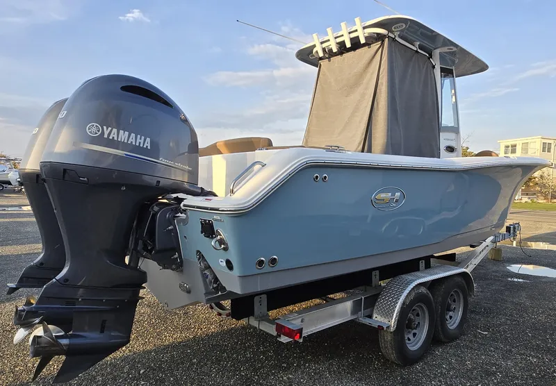 Slide: The Image of 2023 Sea Hunt Ultra 265 SE boat on trailer with Yamaha outboard motor. - 1