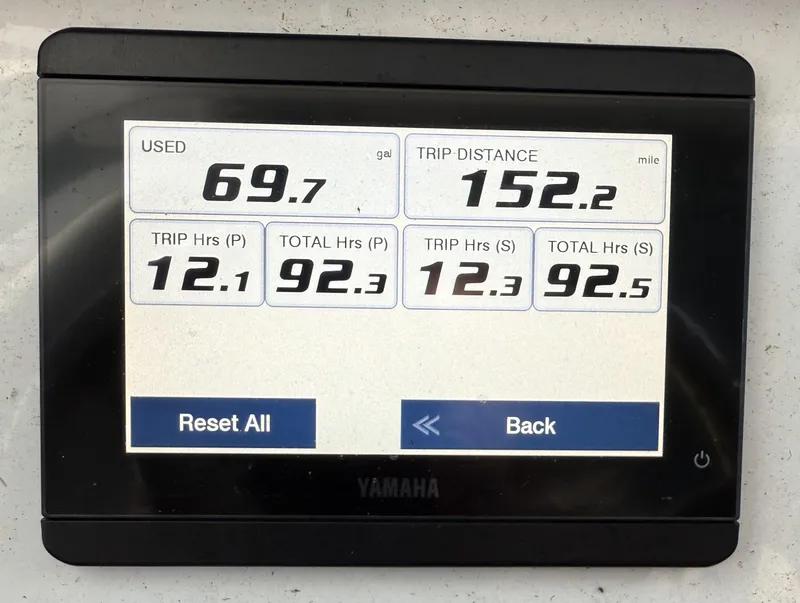 Slide: The Image of Display screen showing trip data for a 2023 Sea Hunt Ultra 265 SE boat. - 5