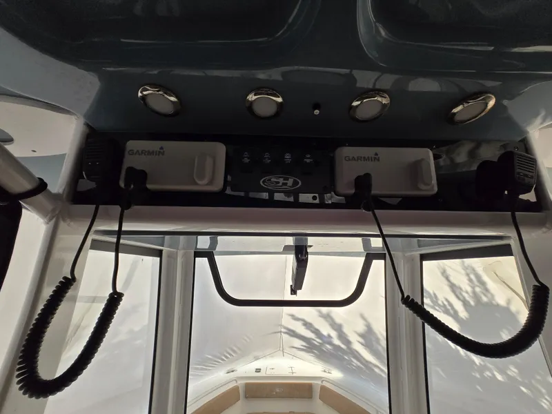 Slide: The Image of 2023 Sea Hunt Ultra 265 SE boat dashboard with Garmin electronics. - 7