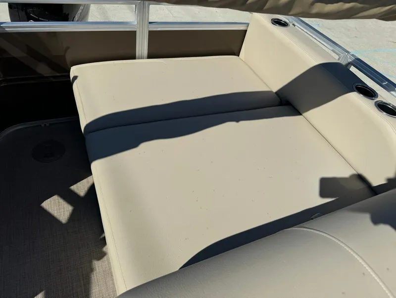 Slide: The Image of 2025 Sun Tracker 24 Sportfish XP3 pontoon boat with spacious seating and modern helm. - 17