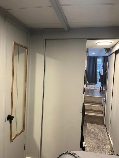 Slide: The Image of Interior of 1976 Sumerset houseboat with modern decor and carpeted stairs. - 11