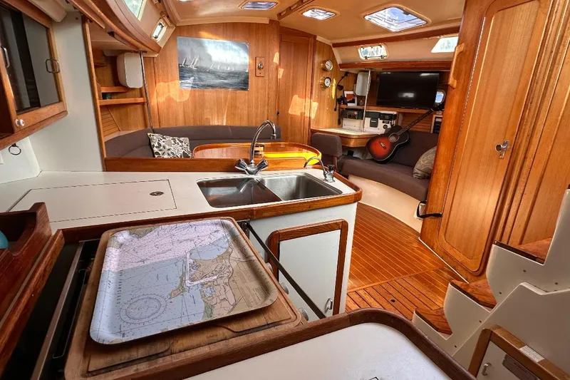 Slide: The Image of Interior of a 1993 Catalina 42 sailboat with wood finish and modern amenities. - 10