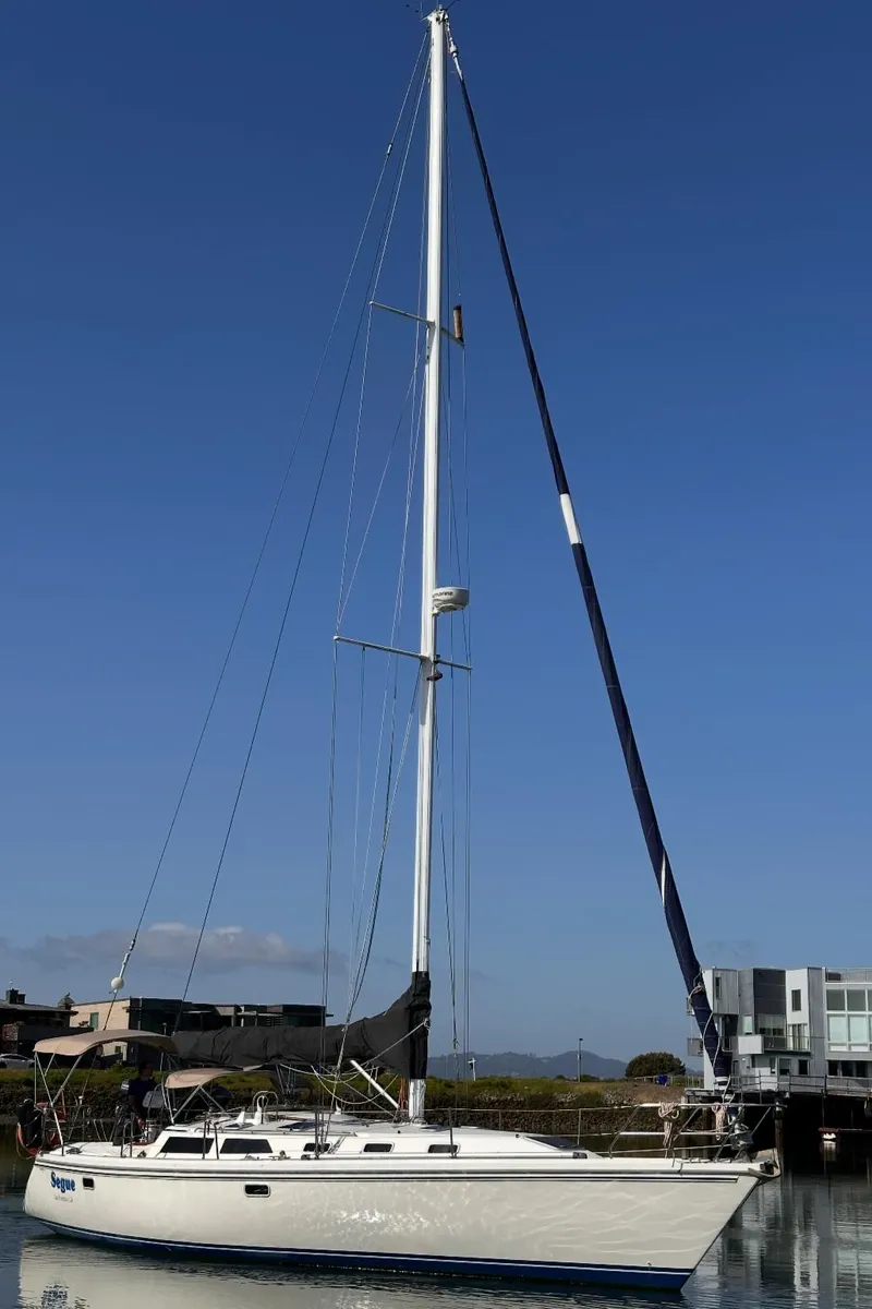 Slide: The Image of Sailboat Catalina 42, 1993 model, docked on calm water under clear blue sky. - 29