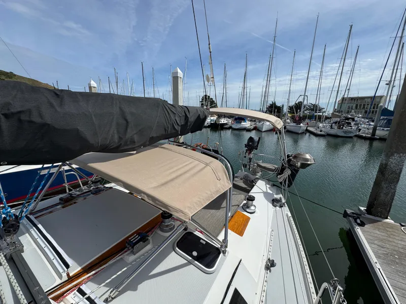 Slide: The Image of Sailboat Catalina 42, 1993 model, docked in a marina with clear skies. - 3